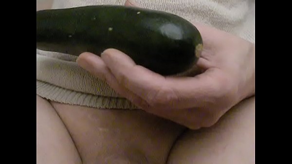 Close-up Fat zucchini anal stretch